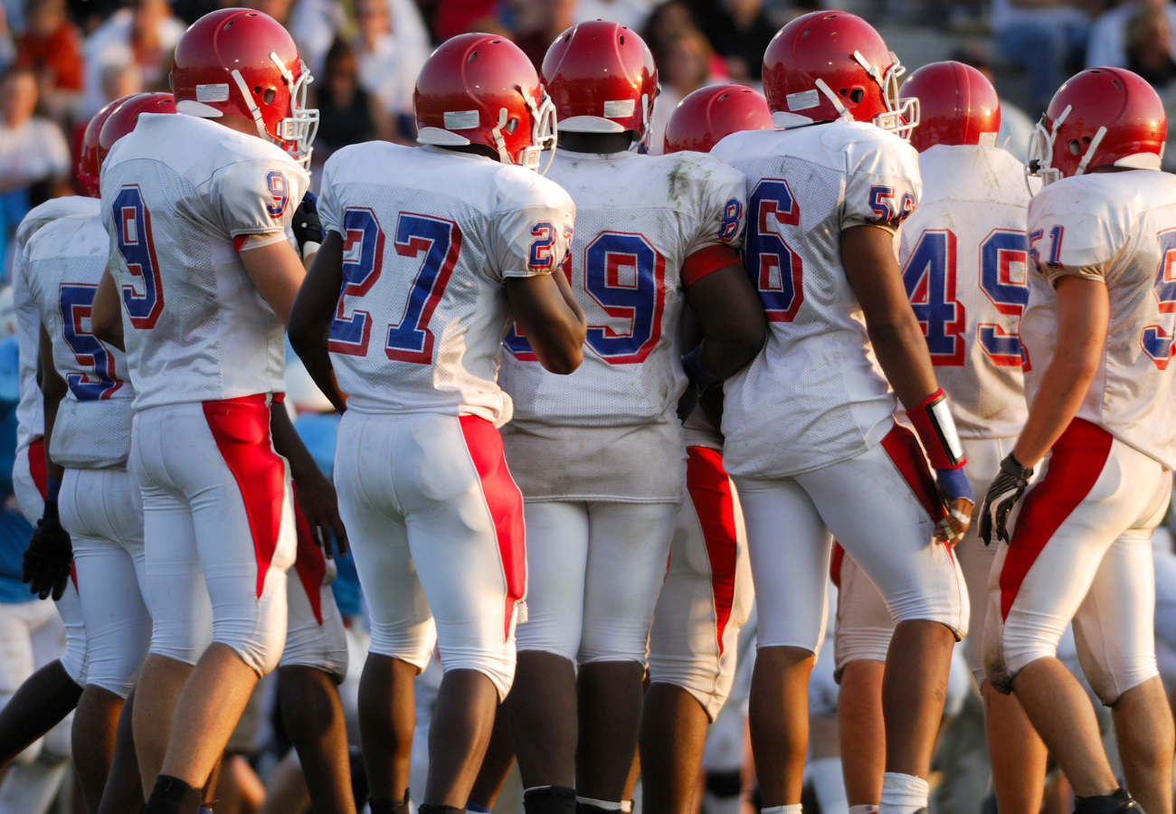 High School Football players on the field depicting skin issues and sports